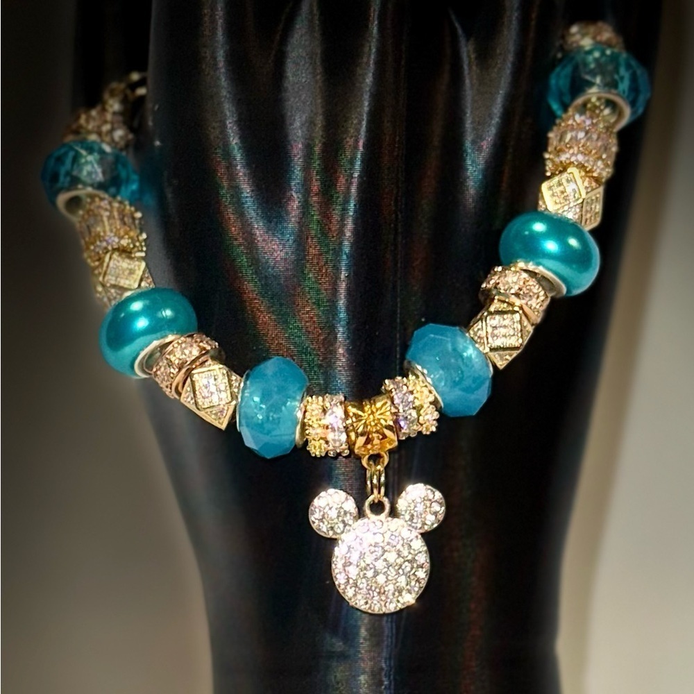 Elegant Gold and Blue Charm Bracelet
